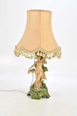 Lot 1592 - A Continental porcelain lamp base, modelled as...