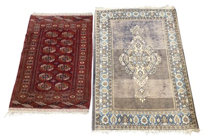 Lot 103 - A Persian hand knotted red ground carpet, with...