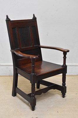 Lot 2051 - A late 19th century oak panel back arm chair,...