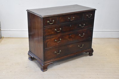 Lot 2128 - A George III mahogany chest, with three short...