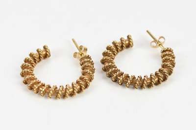 Lot 298 - A pair of yellow metal half hoop earrings with...