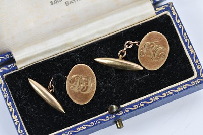 Lot 283 - A pair of 9ct yellow gold cufflinks, with...