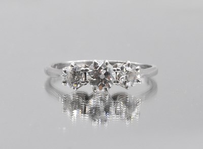 Lot 463 - A white metal diamond graduated three stone...