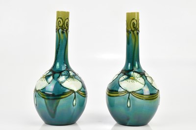 Lot 440 - MINTON; a pair of Secessionist range bottle...