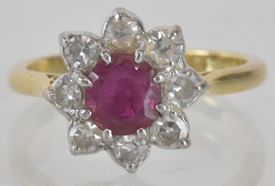 Lot 1255 - An 18ct gold ruby and diamond set floral...