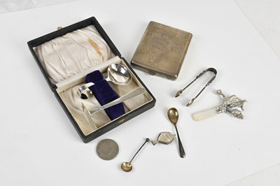 Lot 1509 - A cased sterling silver spoon and food pusher...
