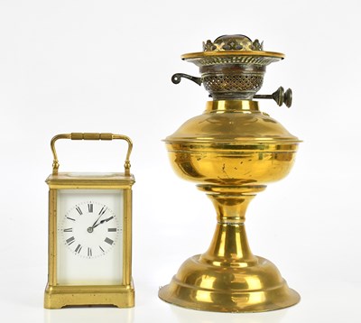 Lot 2270 - A brass cased carriage clock with white enamel...