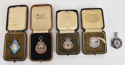 Lot 1128 - Five hallmarked silver prize fobs, including...