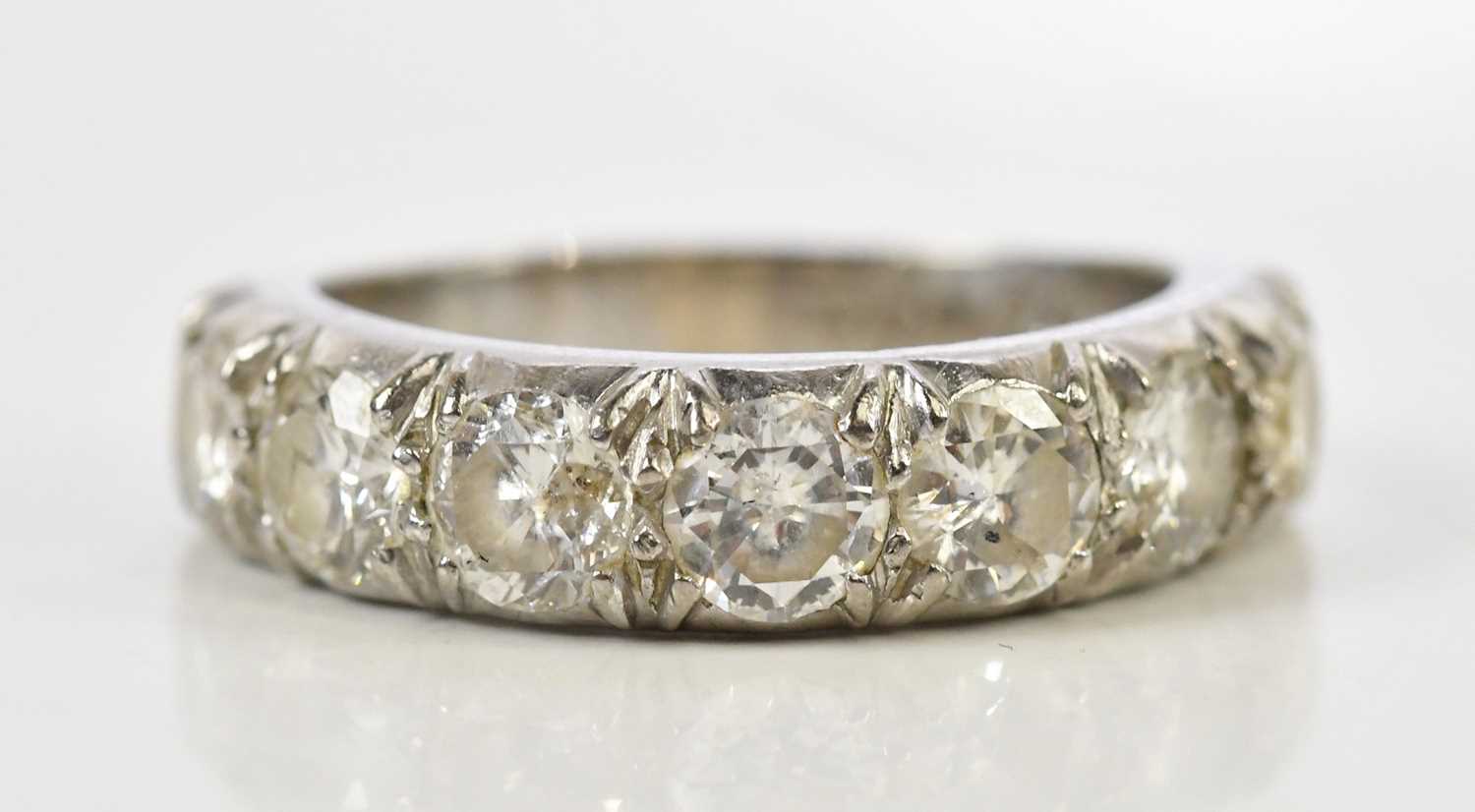 Lot 40 - An 18ct white gold seven stone diamond half...