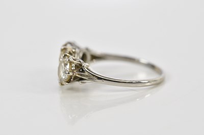Lot 41 - A white metal three stone graduated diamond...