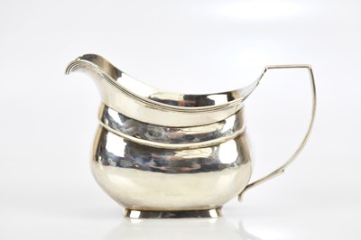 Lot 1301 - A Georgian hallmarked silver cream jug, marks...