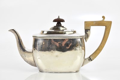Lot 1390 - A George V hallmarked silver teapot of square...
