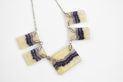 Lot 364 - A white metal necklace formed of five leaf...