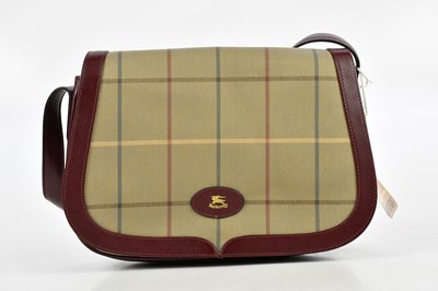 Lot 671 - BURBERRYS; an unused Diane mulberry coloured...