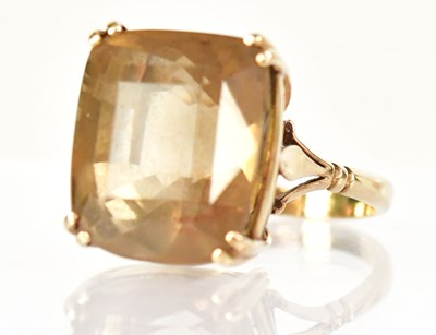 Lot 780 - A 9ct yellow gold dress ring with claw set...