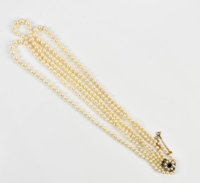 Lot 377 - A three strand pearl necklace with 9ct clasp...