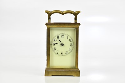 Lot 2271 - A brass cased carriage clock with white enamel...