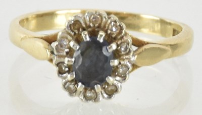 Lot 1297 - A 9ct yellow gold sapphire and diamond set...