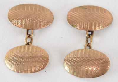 Lot 1526 - A pair of 9ct yellow gold oval cufflinks, with...