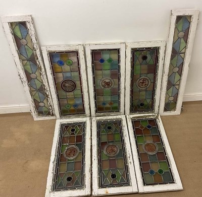 Lot 269 - Stained glass panels, the six wider with...