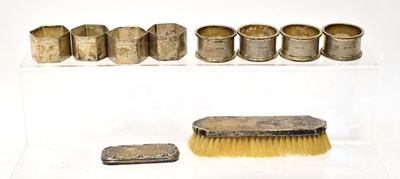Lot 630 - Two sets of four George V napkin rings, one...