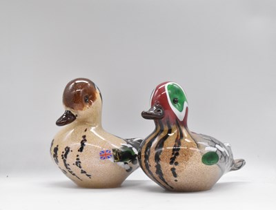 Lot 211 - LANGHAM; a pair of glass male and female teal...