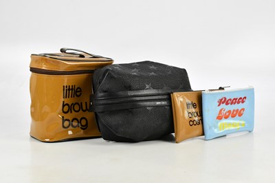 Lot 707 - JIMMY CHOO; a black leather washbag, with star...
