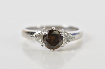 Lot 43 - An 18ct white gold fancy cognac diamond and...