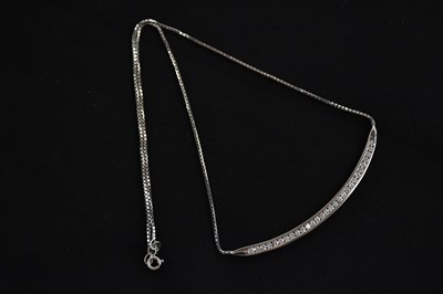 Lot 326 - An 18ct white gold diamond set necklace, with...