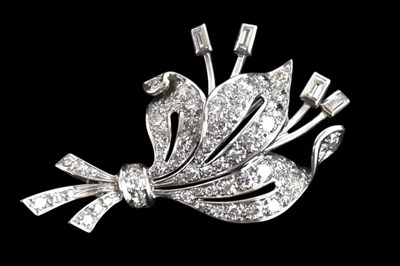 Lot 258 - A white metal diamond set floral brooch, with...