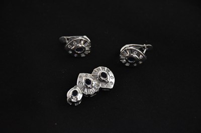 Lot 330 - An 18ct white gold sapphire and diamond...