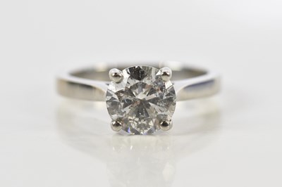 Lot 31 - A platinum and diamond solitaire ring, the...