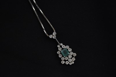 Lot 318 - A 14ct white gold chain suspending a diamond...