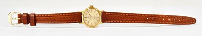 Lot 1016 - OMEGA; a ladies' gold-coloured wristwatch, the...