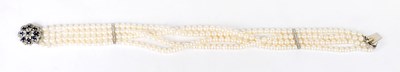 Lot 879 - A four-strand cultured pearl choker set with...