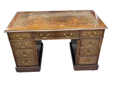 Lot 2093 - An early 20th century walnut pedestal desk...