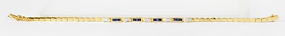 Lot 806 - An 18ct yellow gold bracelet with shaped links...