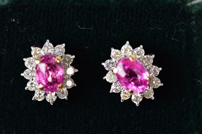 Lot 887 - A pair of 18ct yellow and white gold earrings...
