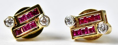 Lot 886 - A pair of 18ct yellow gold stud earrings, each...