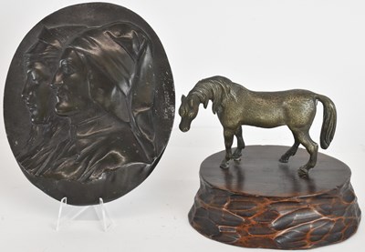 Lot 759 - A bronzed oval plaque with the profile...