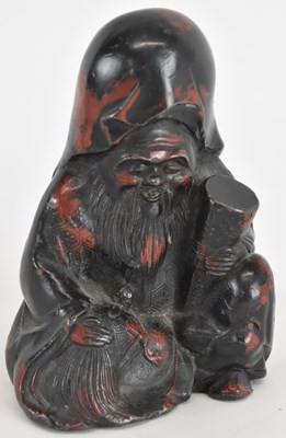 Lot 800 - A small metal figure of Shou Lao, with traces...