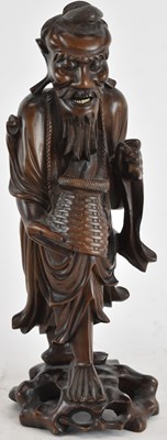 Lot 822 - A Chinese carved rootwood figure of a bearded...