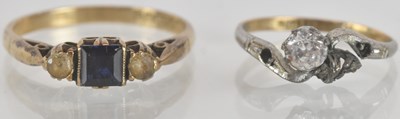 Lot 1303 - A 9ct yellow gold sapphire dress ring, size S...