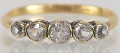 Lot 1304 - An 18ct yellow gold five stone graduated old...
