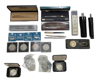 Lot 322 - A quantity of assorted pens and coins,...