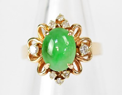 Lot 773 - A 14ct yellow gold ring set with an oval green...