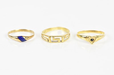 Lot 173 - Three yellow metal rings stamped '585',...