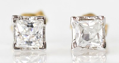 Lot 890 - A pair of 9ct white gold stud earrings set...