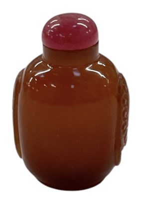 Lot 795 - A Chinese carved amber coloured glass snuff...
