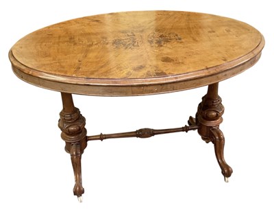 Lot 84 - A Victorian walnut oval centre table, on...